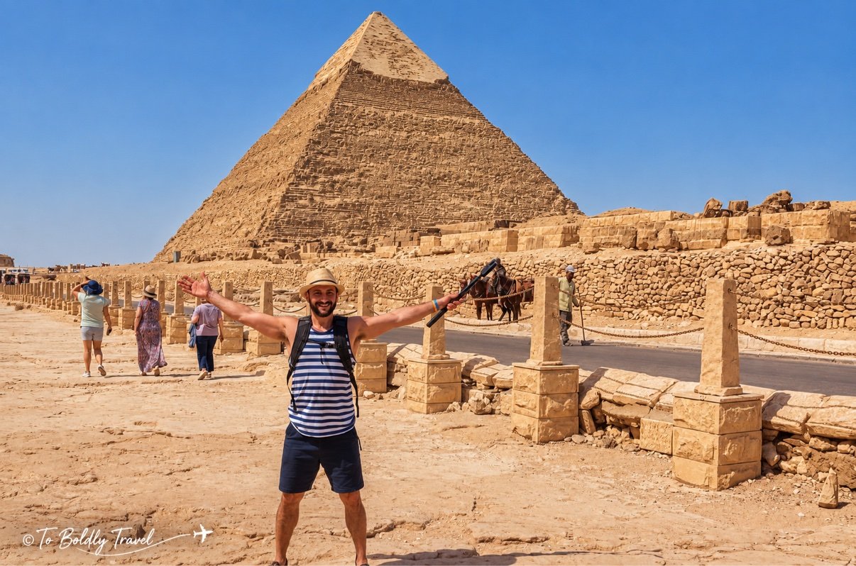 Michel, arms wide, in front of Khafre's pyramid at Giza