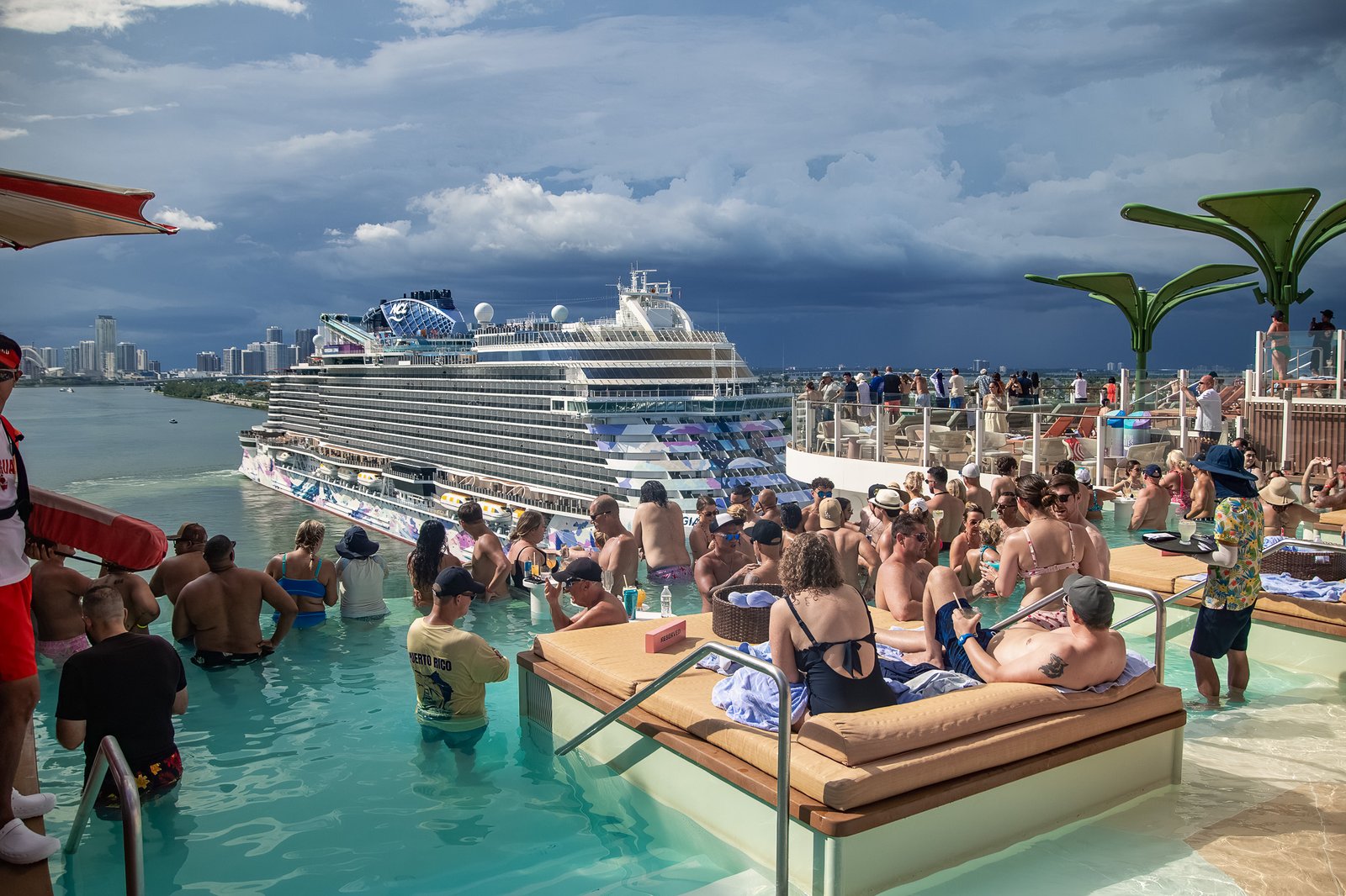 Hideaway pool as a sister mega-ship sails past in Miami harbor