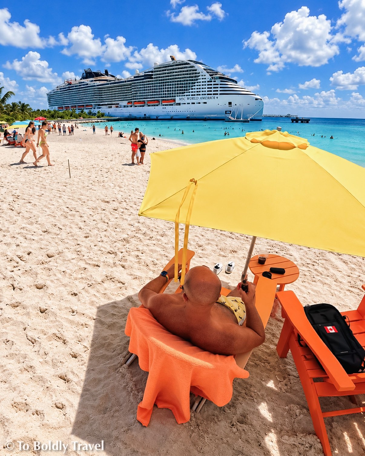 Michel reclining on an orange lounger under a yellow umbrella